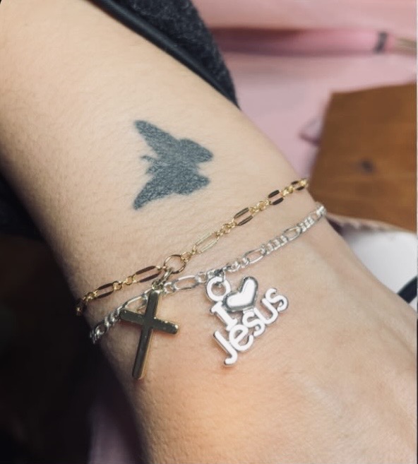 Gold and silver bracelets with cross and Jesus charms