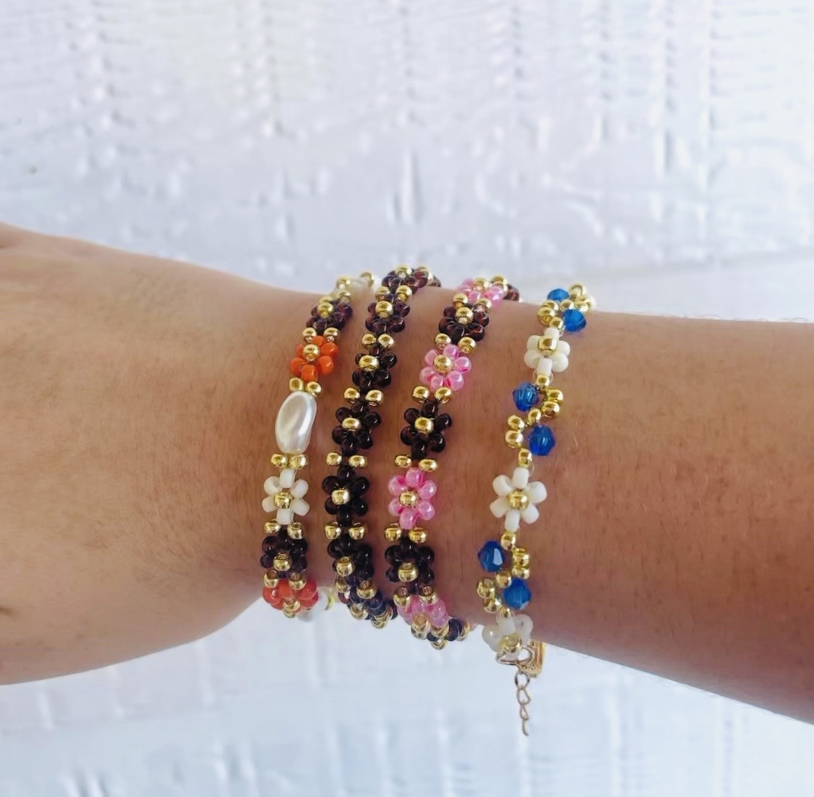 Stacked beaded daisy flower bracelets