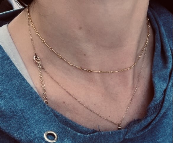 Layered dainty gold and silver necklaces